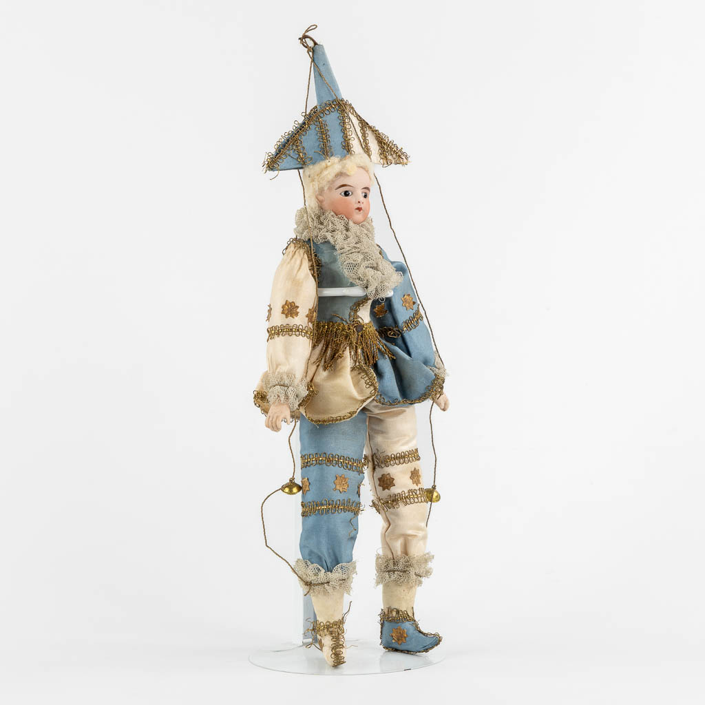 A French porcelain and fabric doll, Policinelle