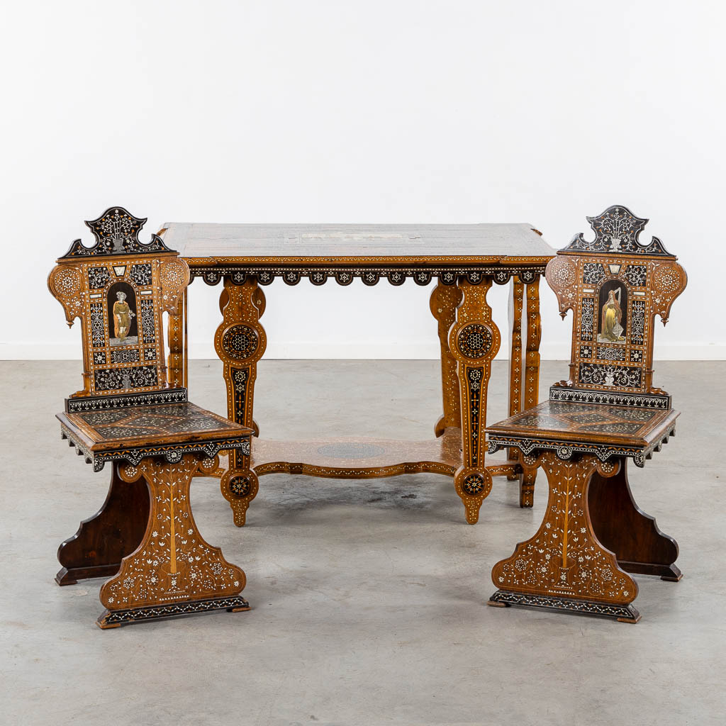 A Syrian table with two matching chairs, Marquetry and copper inlay, 19th C. (L:87 x W:121 x H:80 cm)