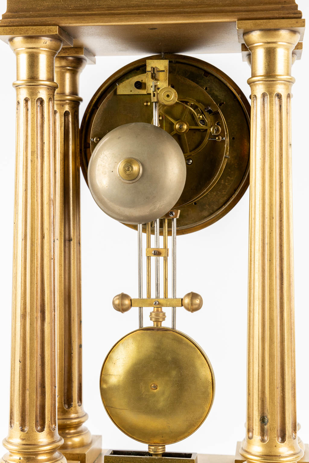 An antique column clock, bronze with a horse figurine. 19th C. (L:18 x W:27 x H:62 cm)