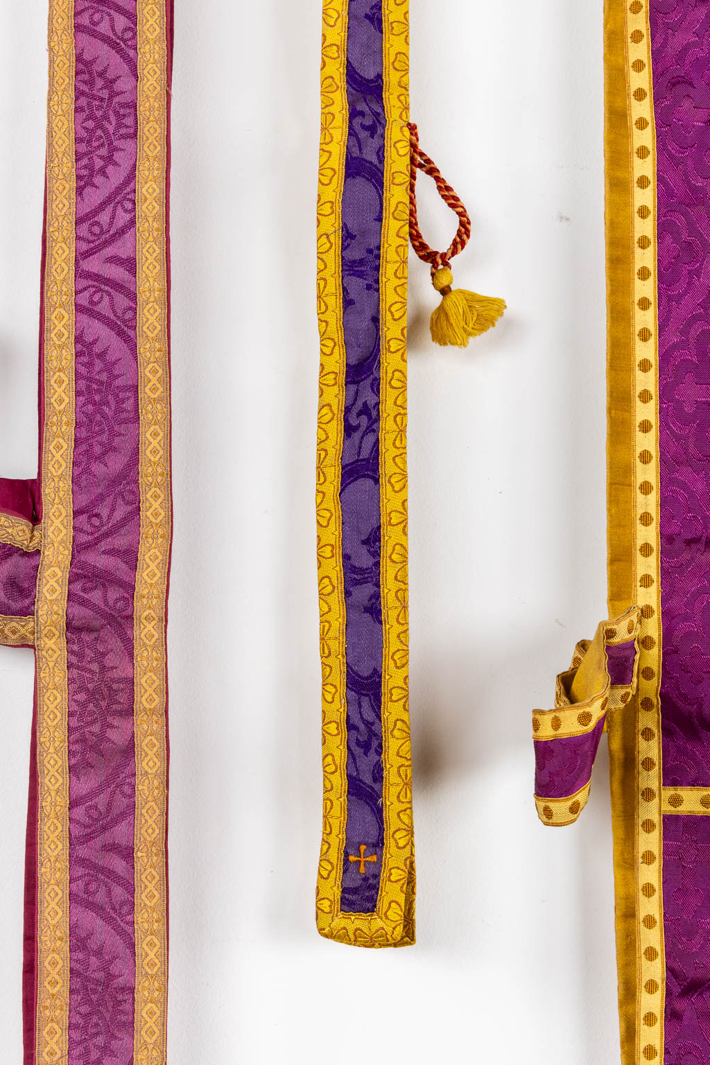 Two Dalmatics and a Roman Chasuble, added are a big collection of stola and maniple. 