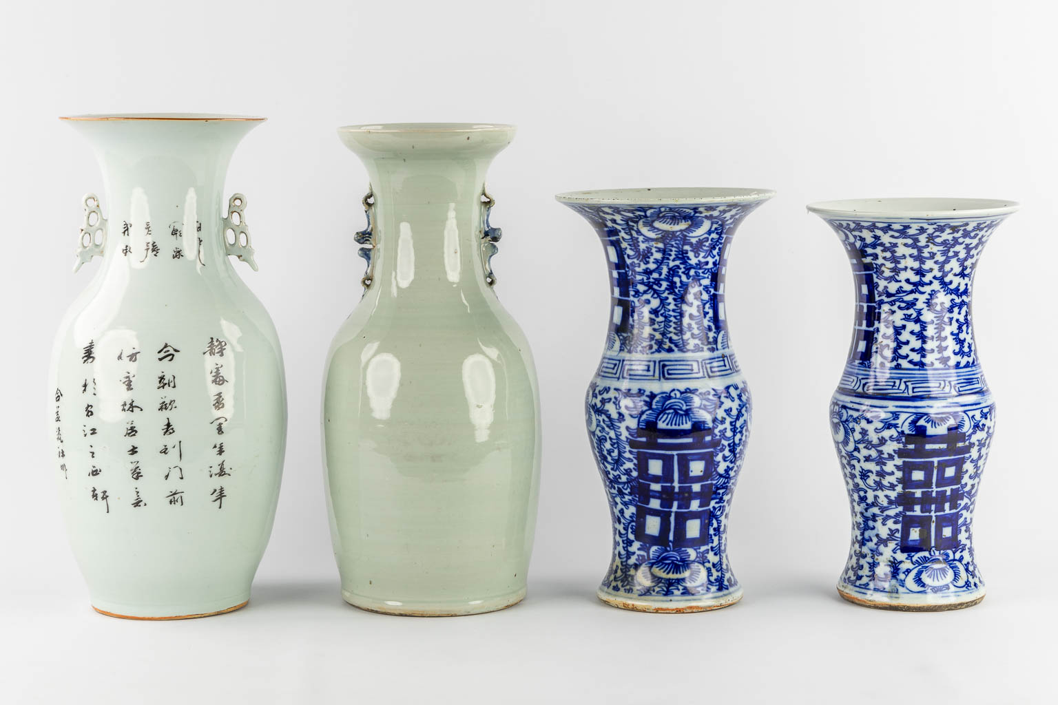 Four Chinese vases, blue white and polychrome. 