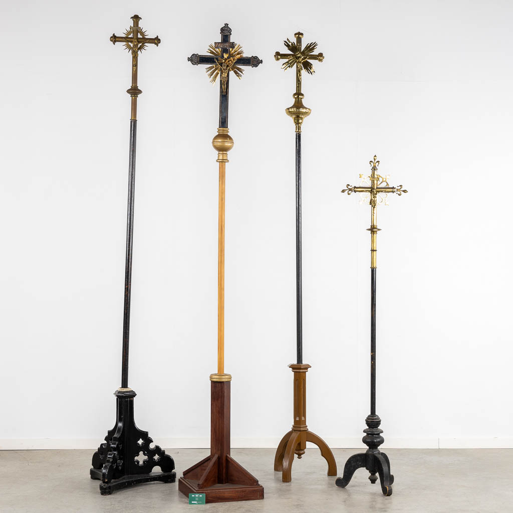 Four Processional crucifixes with their stands. Silver-plated metal and Brass. (H:265 cm)