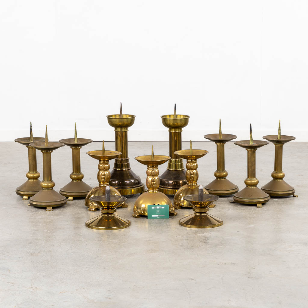 Thirteen Chruch candlesticks, brass and bronze. (H:40 cm)