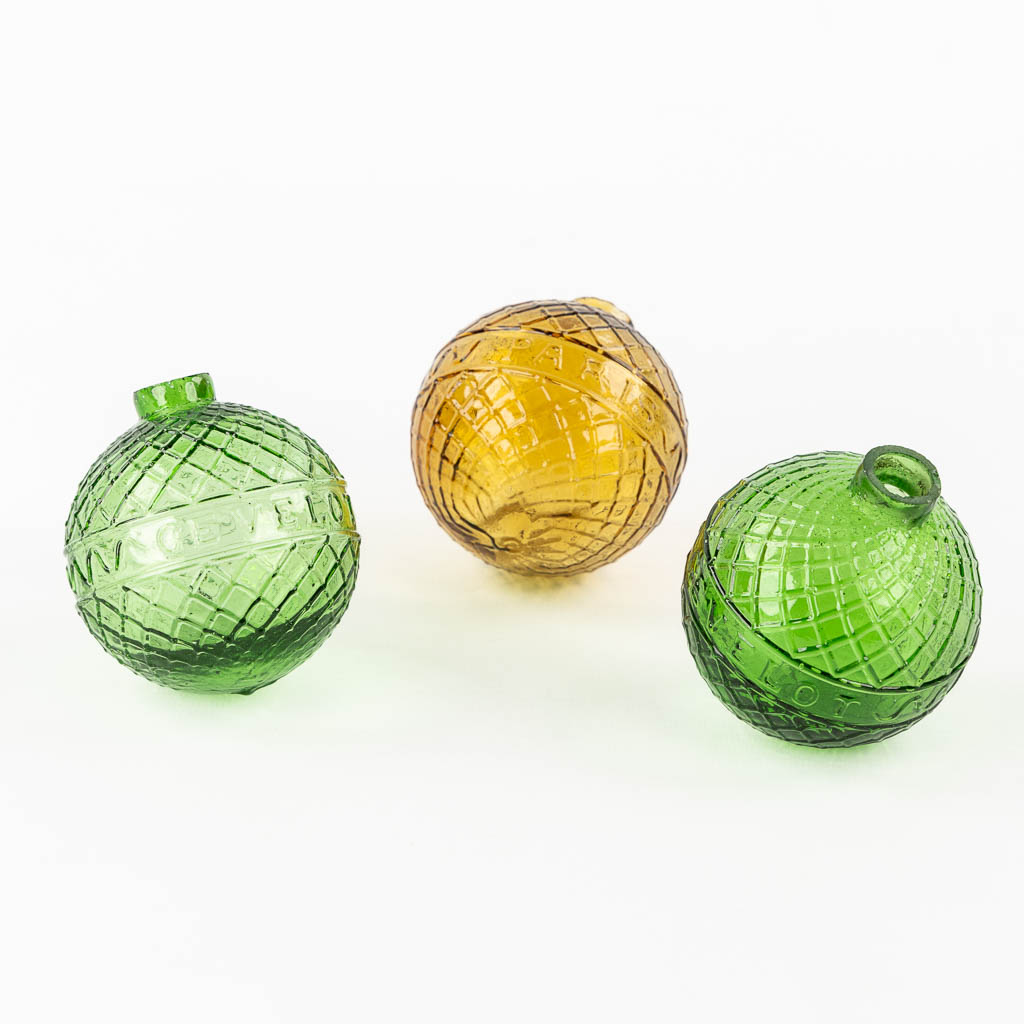 Gevelot Paris. Three antique target practice balls, Moulded glass, green and amber. 