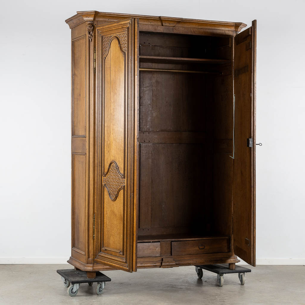 A two-door wardrobe, Louis XIV, 18th C. (L:63 x W:168 x H:235 cm)