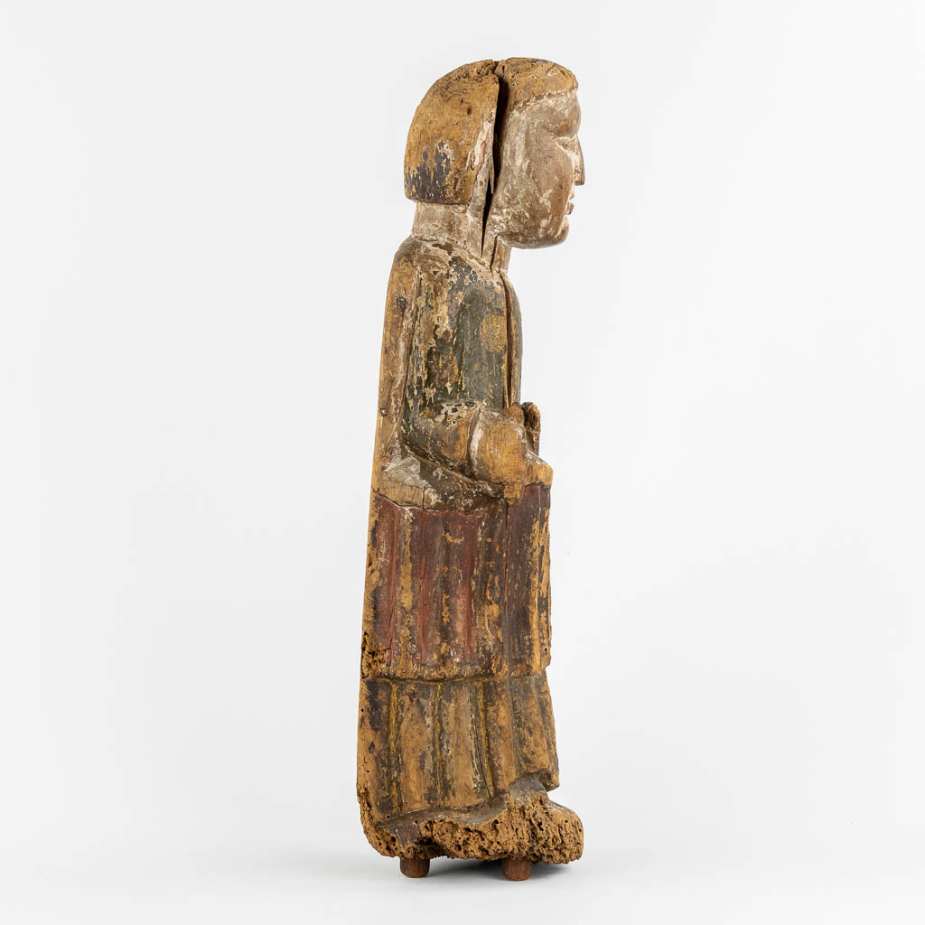 An antique wood sculpture of a Deacon, Roman period, possibly Catalonia. 12th C. (L:14 x W:15 x H:57 cm)