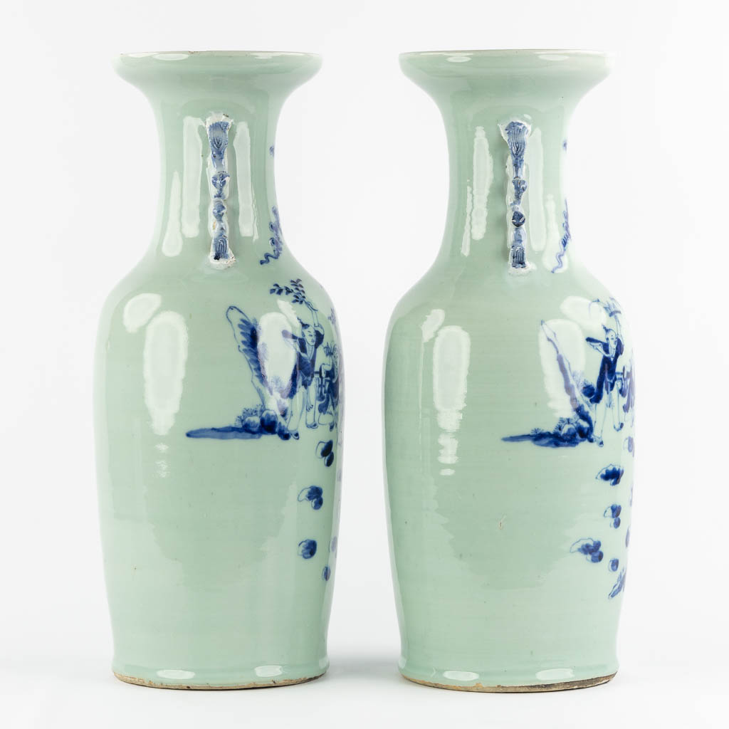 A pair of Chinese vases with a blue-white decor of playing children. (H:57,5 x D:21 cm)