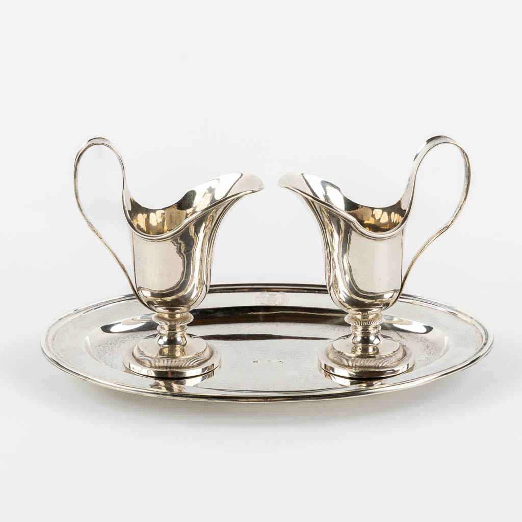 Phillipus MYS (1801-1881) 'Wine and water cruets', Bruges, Silver. 779g. (L:18,5 x W:26,5 x H:14 cm)