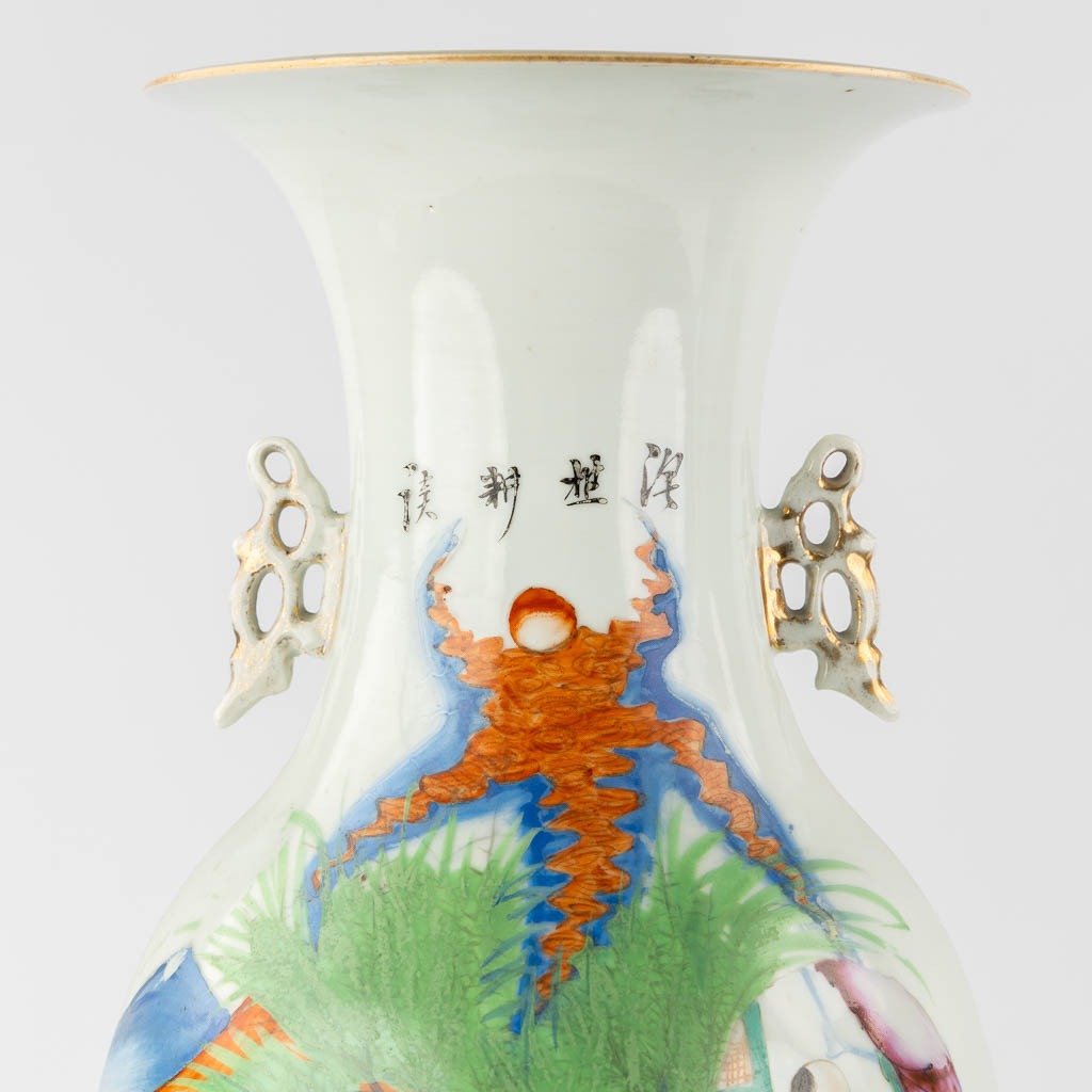 A pair of Chinese vases, decorated with playing children and kaligraphic texts. (H:59 x D:23 cm)