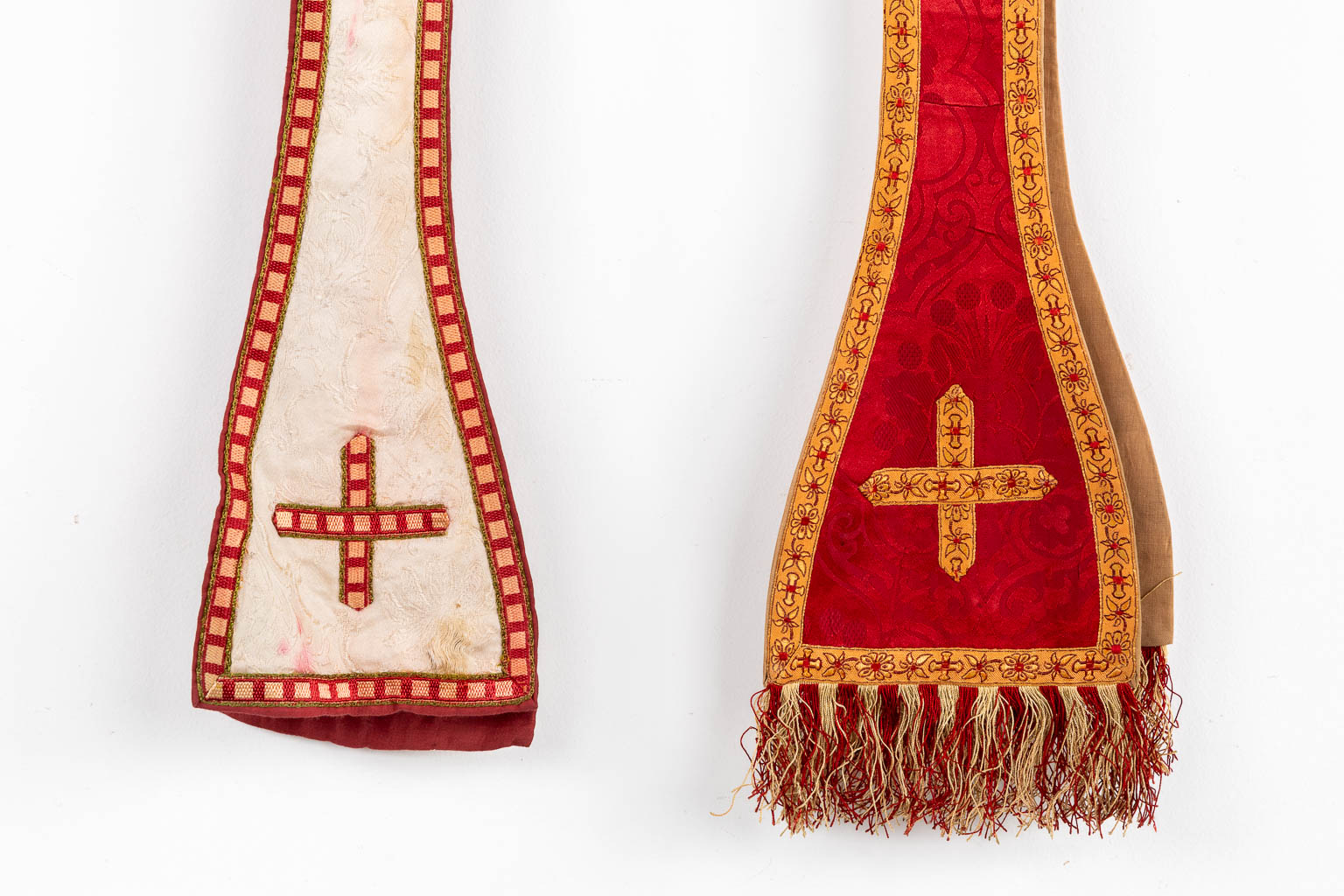 Two Dalmatics and a Roman Chasuble, added are a big collection of stola and maniple. 