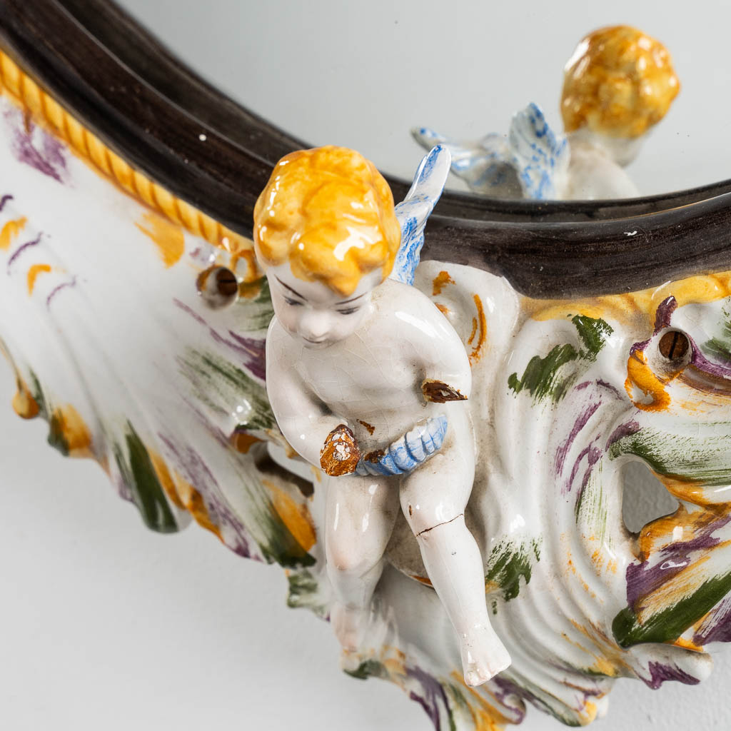 Capodimonte, a large mirror with porcelain rim. 20th C. (W:67 x H:110 cm)