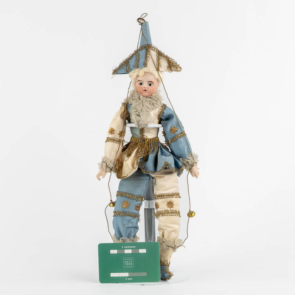 A French porcelain and fabric doll, Policinelle