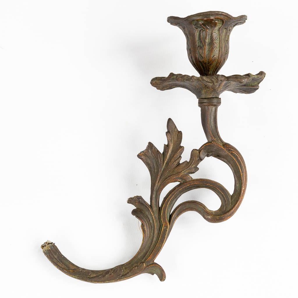 A three-piece mantle garniture clock and candelabra, spelter mounted on marble. Circa 1900. (L:28 x W:42 x H:77 cm)