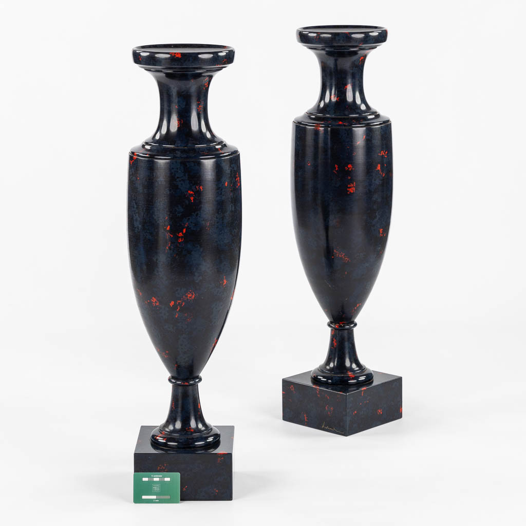 A pair of higly decorative and large urns, wood turned with a 'Faux Marble' decor.