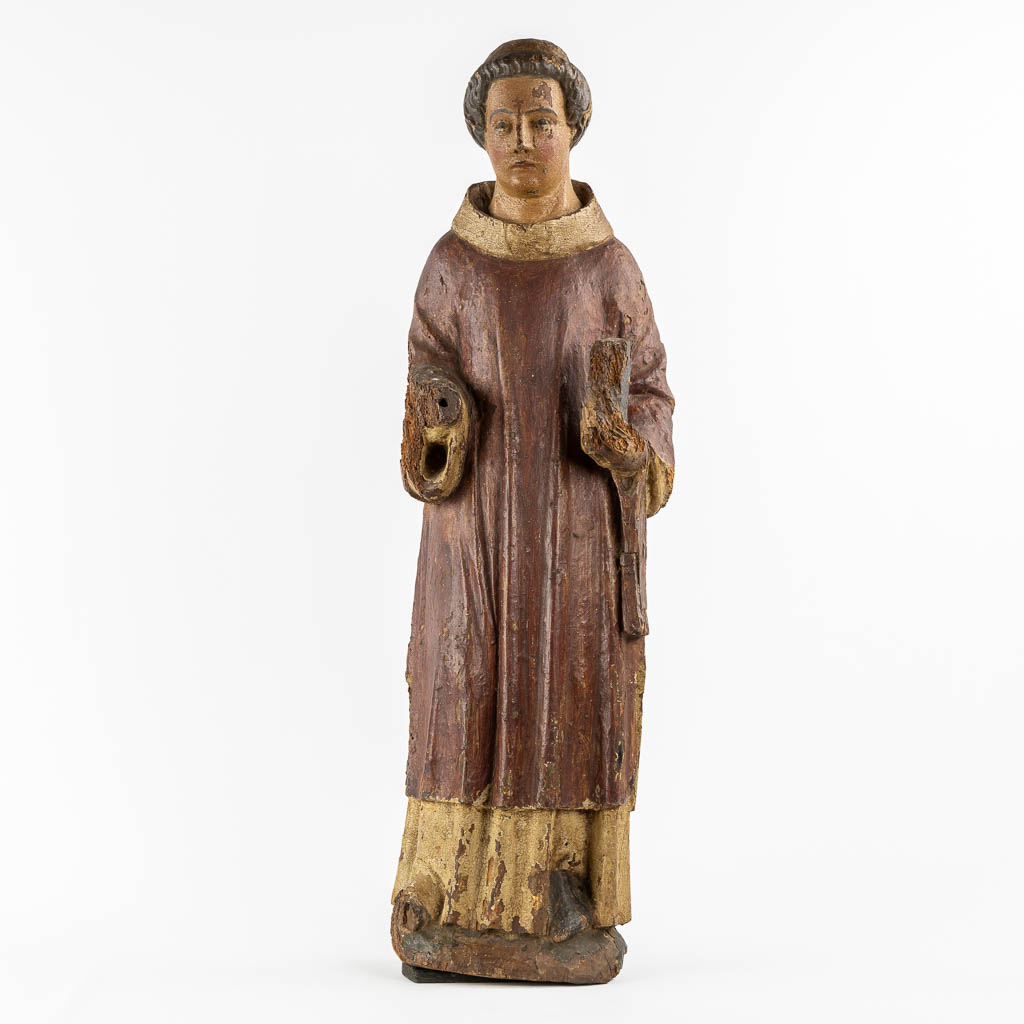 Saint Laurentius, Deacon. A wood-sculpture, oak, 14th C.  (L:20 x W:25,5 x H:90 cm)