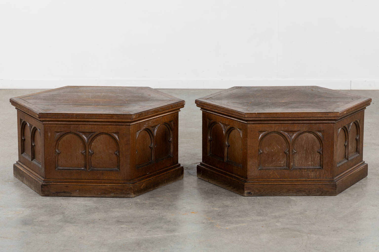 A pair of pedestals for large candelabra, sculptured oak, Gothic Revival. (H:40 x D:76 cm)