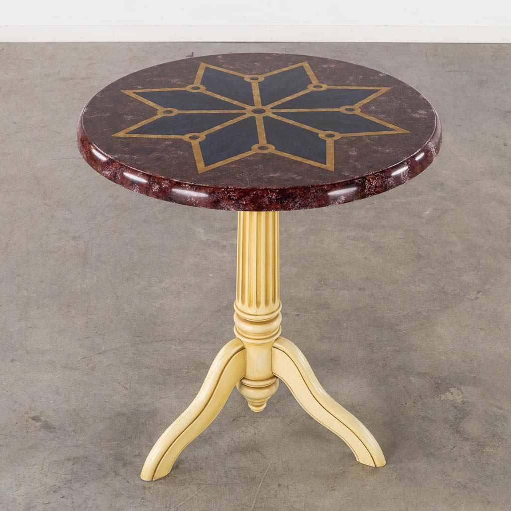 A decorative side table with a geometric decor 'Faux Lapis Lazuli and marble'.