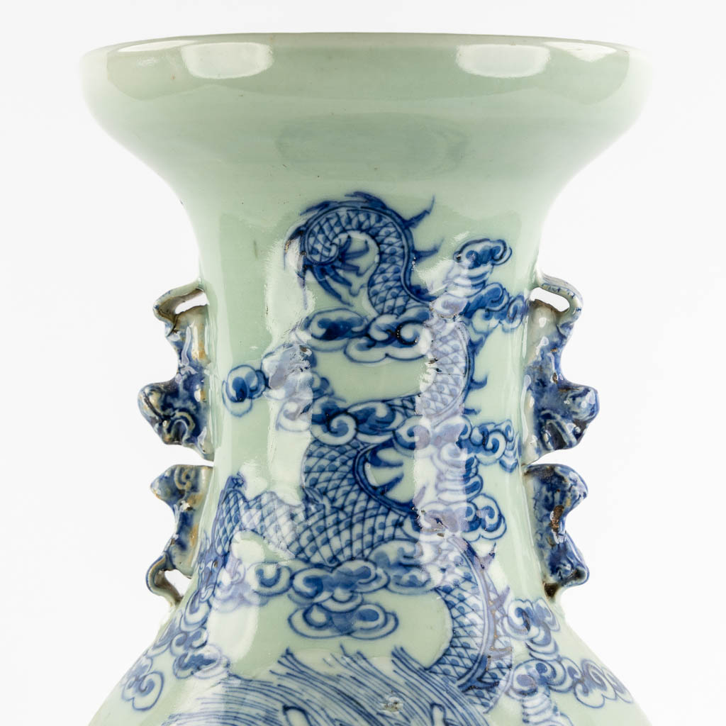 A Chinese Celadon vase with a Dragon and fish. (H:58 x D:23 cm)