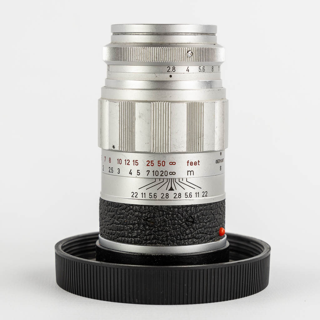 Leica, Four lenses and two filters. (H:15,5 cm)