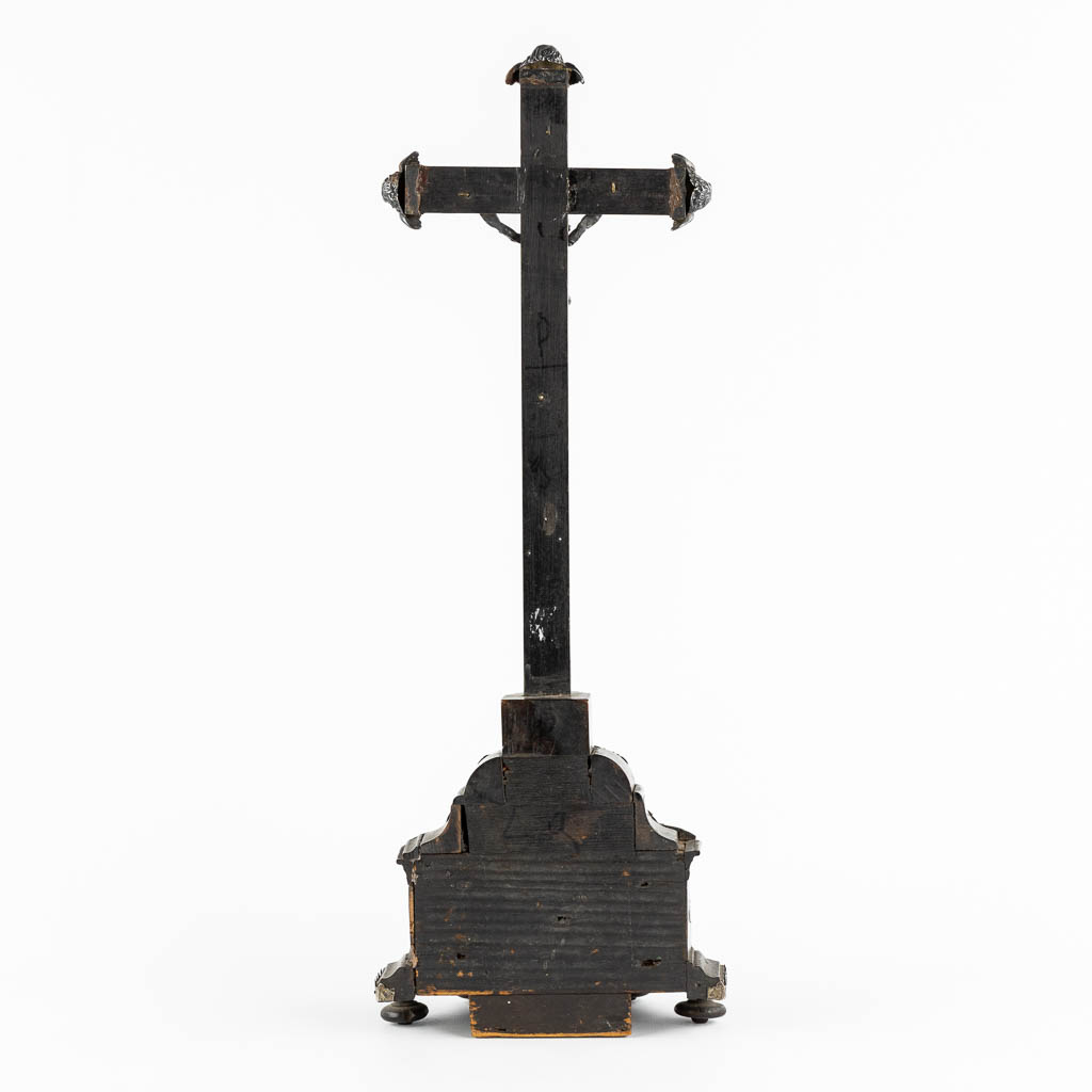 An ebonised wood Reliquary crucifix, 7 relics, mounted with silver. 19th C. (W:17 x H:50 cm)