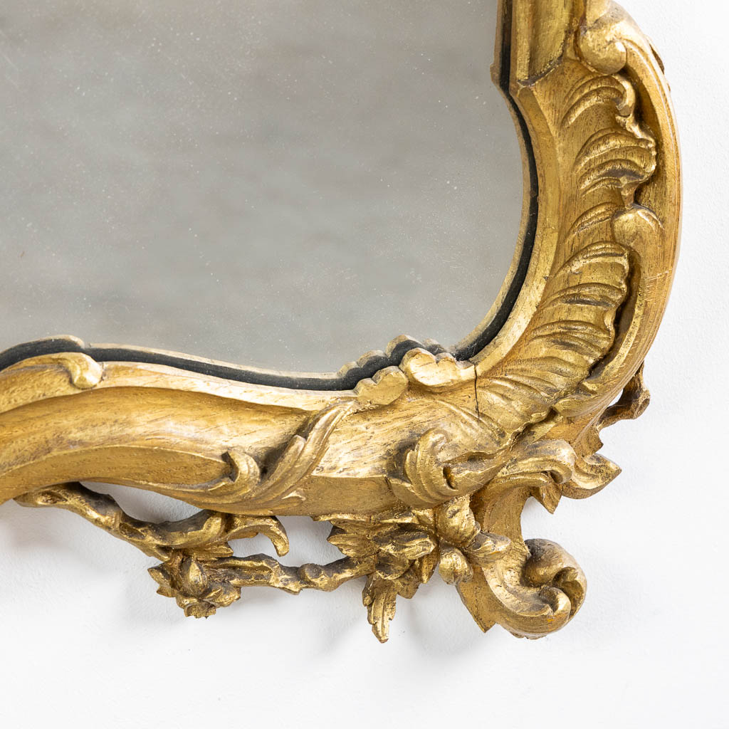 An antique wood-sculptured mirror, Louis XV style. Circa 1900. (W:93 x H:135 cm)