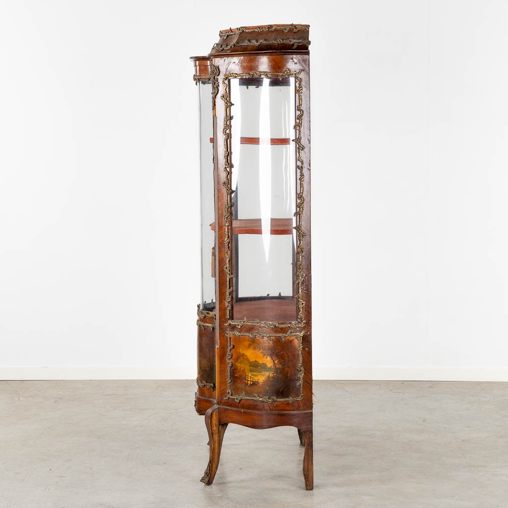 A display cabinet with painted scène, curved glass and mounted with bronze. (L:45 x W:80 x H:169 cm)