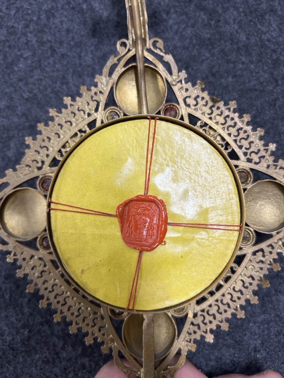 A reliquary monstrance with 6 relics, spelter and cloisonné enamel. 1901. (W:16 x H:36 cm)