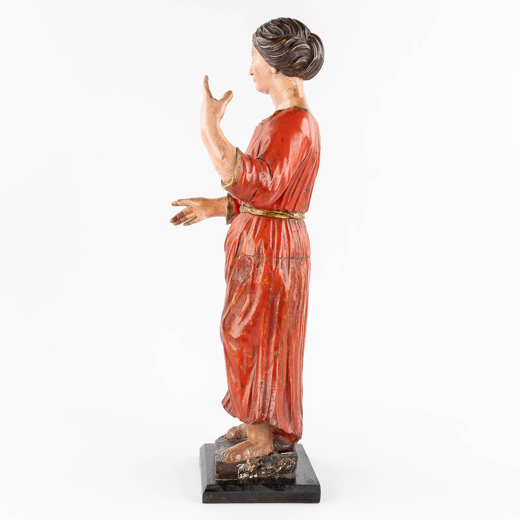 An antique wood-sculptured and polychrome figurine of a noble lady. 18th/19th C. (L: 20 x W: 25 x H: 60 cm)