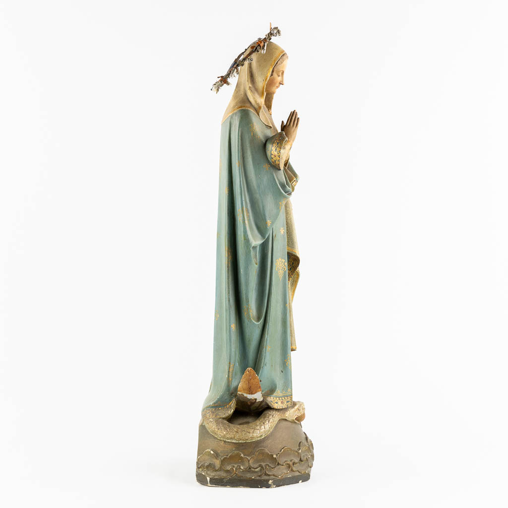 A Gothic Revival Virgin Mary on Crescent moon trampling the serpent, Polychrome plaster. Circa 1900. (H:81 cm)