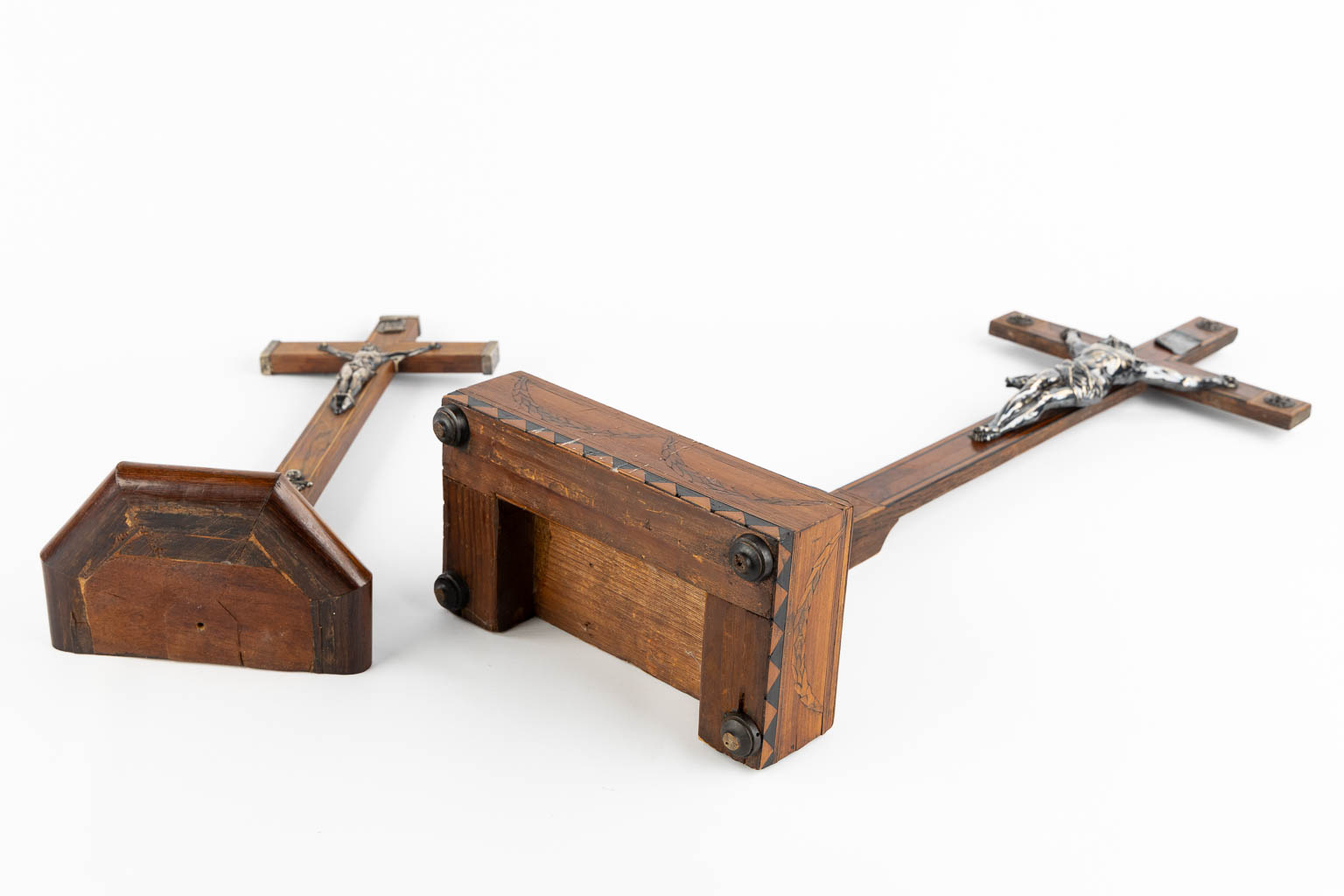 Two crucifixes with a silver Corpus Christi, 19th C. (W:24 x H:70 cm)