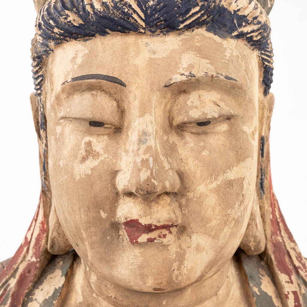 A large and antique wood sculptured buste of Guanyin. (L:28 x W:50 x H:69 cm)