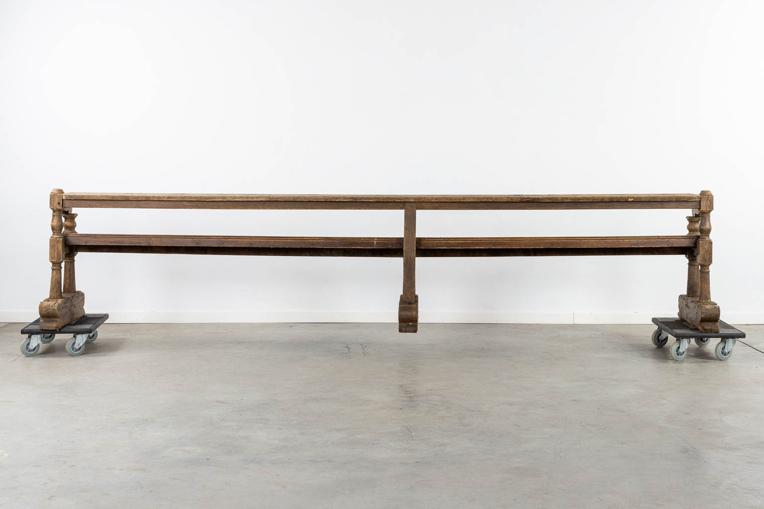 A pair of large Church benches, sculptured oak, 18th C. (L:55 x W:350 x H:72 cm)