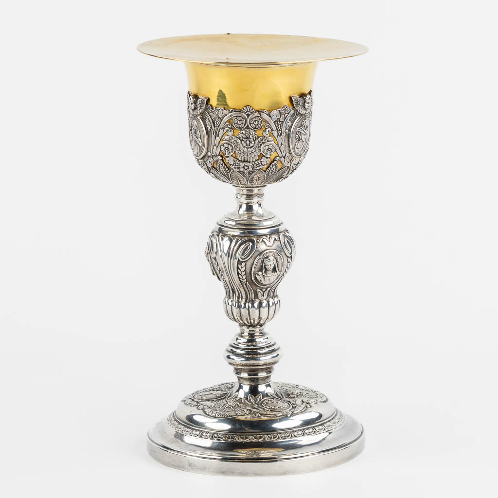 A silver chalice with a vemeil cuppa, rich decor in Baroque style. 19th C. (H:26 x D:14 cm)