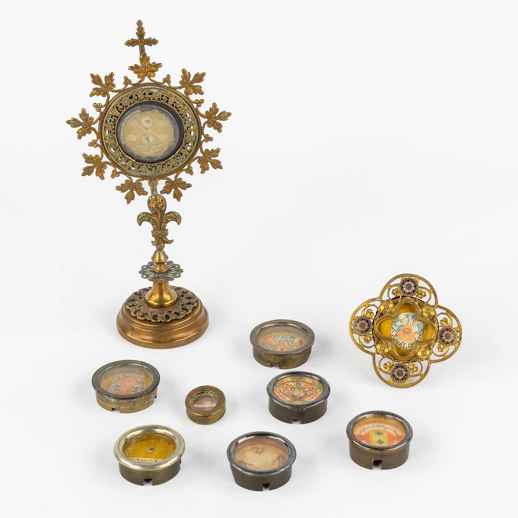 Nine sealed theca with documents, relics for saints and Virgin Mary. (H:20,5 cm)