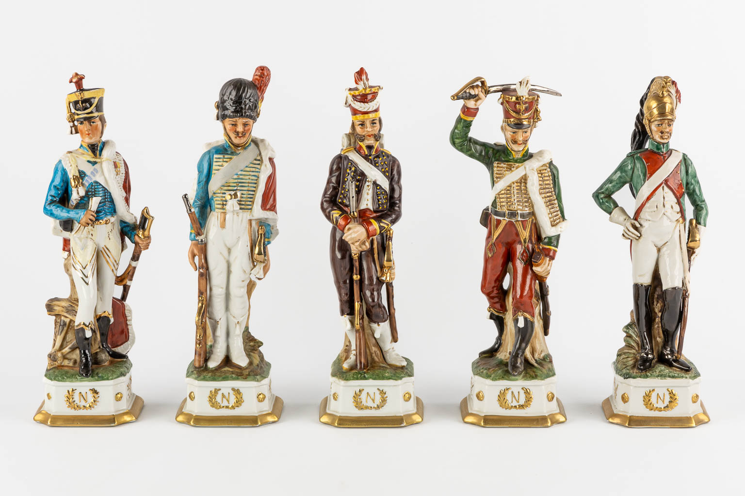 Napoleon and the generals, polychrome porcelain. 15 + 3 pieces. (L:9,5 x W:10 x H:31 cm)