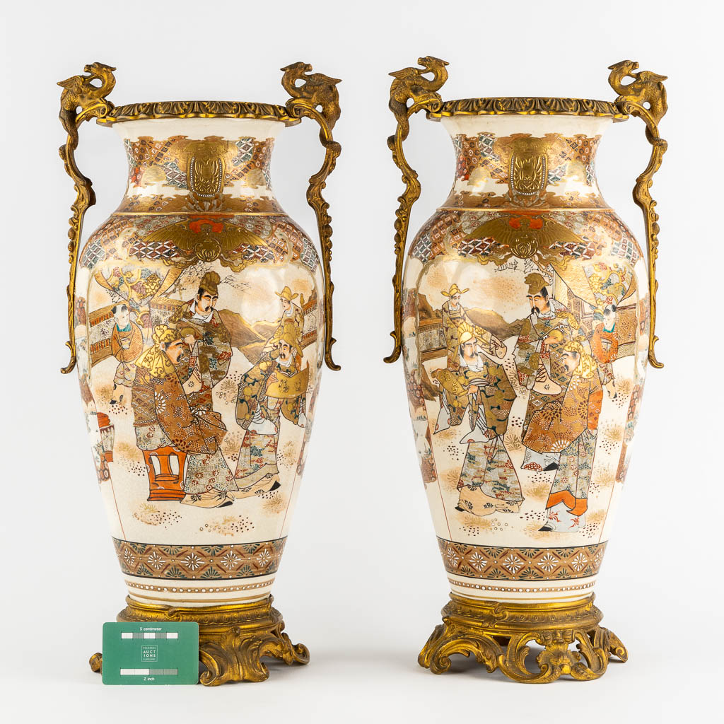 A pair of Japanese Kutani vases, mounted with bronze. Added a Chinese Canton vase. (L:24 x W:27 x H:56 cm)