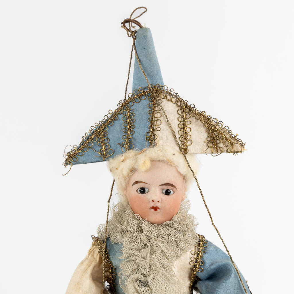 A French porcelain and fabric doll, Policinelle