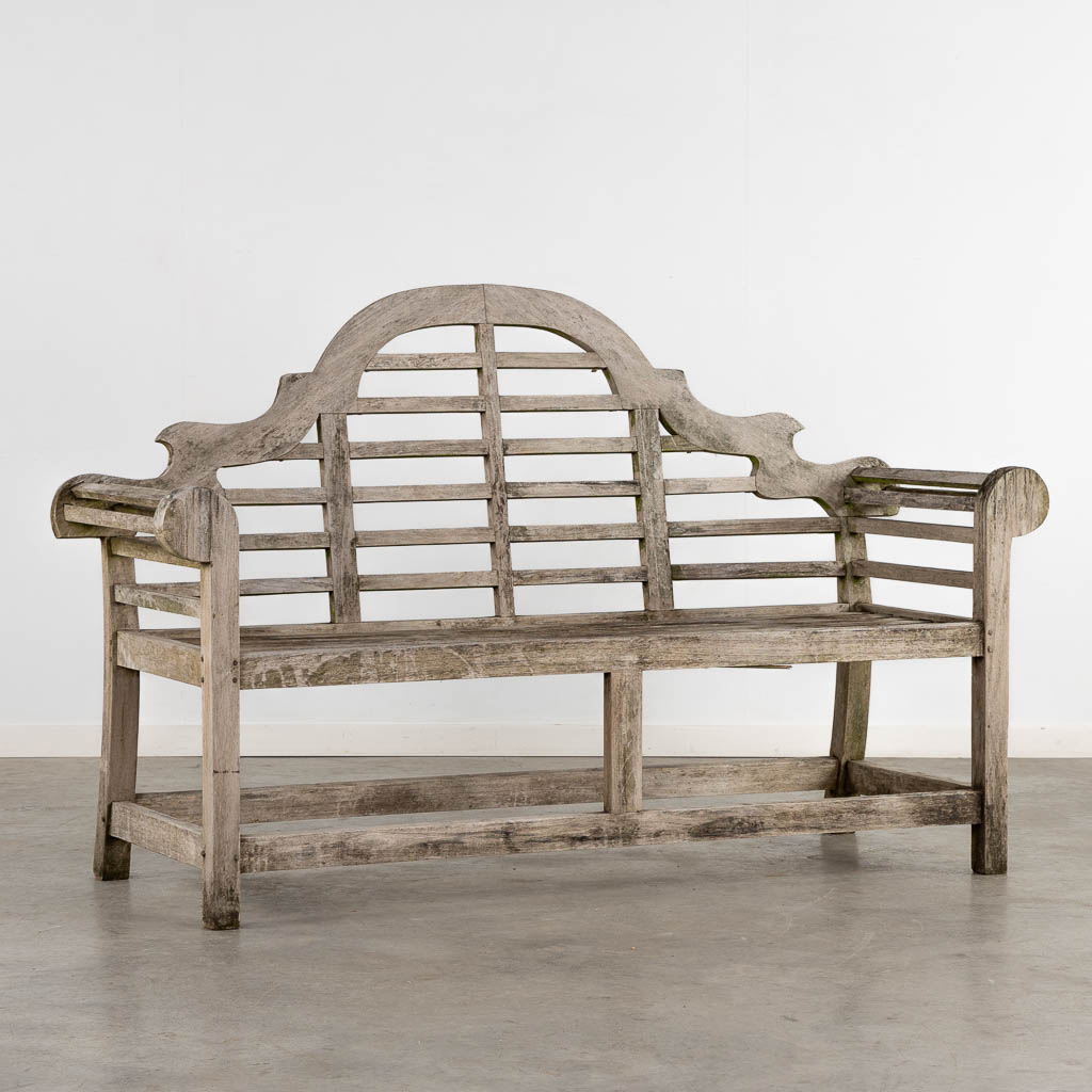 A teak garden bench. (L:60 x W:168 x H:104 cm)