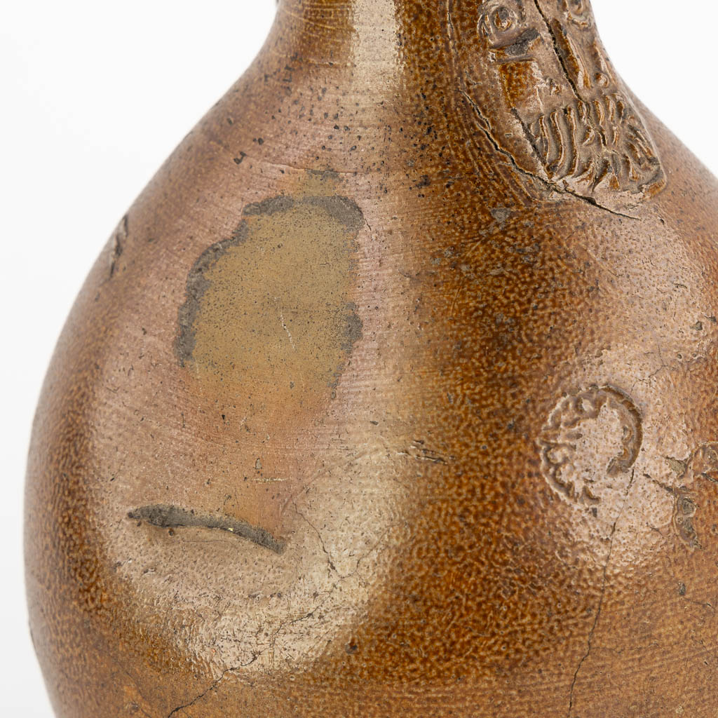 An antique Bartmann jug with three stamps, 17th C. (H:27 x D:17 cm)