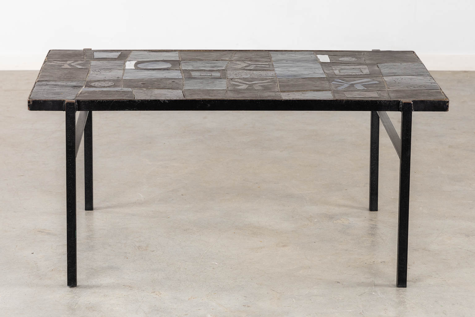 A mid-century coffee table, ceramic tiles on a metal base, circa 1970. (L:75 x W:110 x H:50 cm)