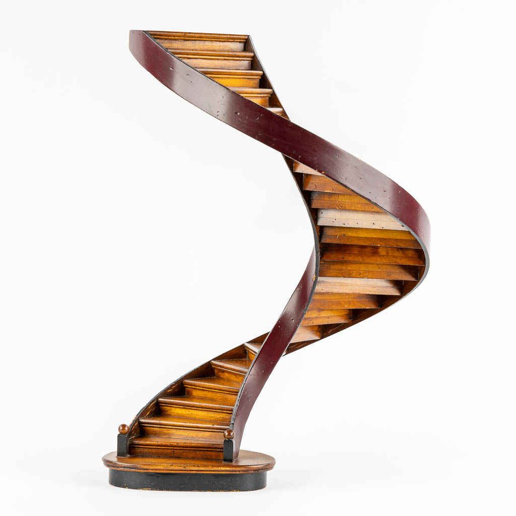 An architectural model of a revolving staircase, wood. 20th C. (H:47,5 x D:29 cm)