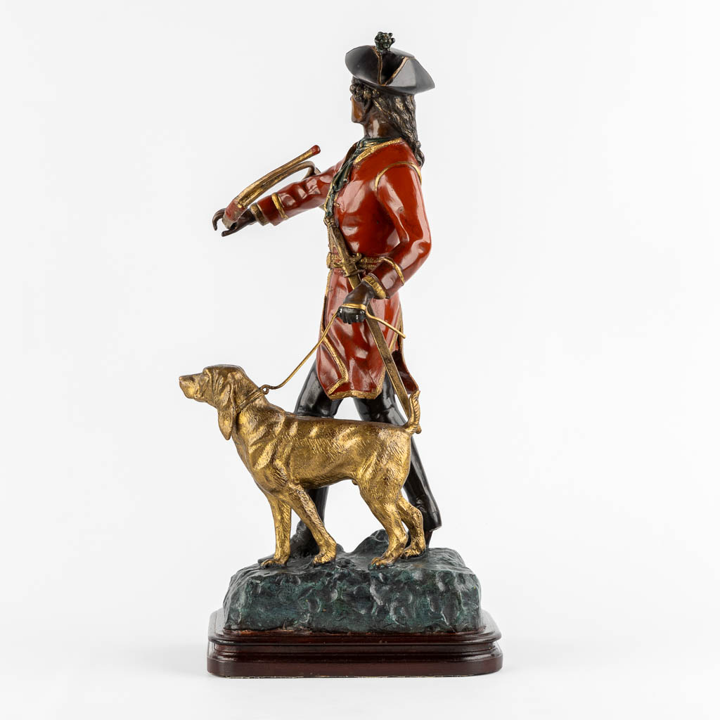 After Pierre Jules Mène, Hunter with his horn and dog. Patinated bronze. (L:29 x W:35 x H:62 cm)