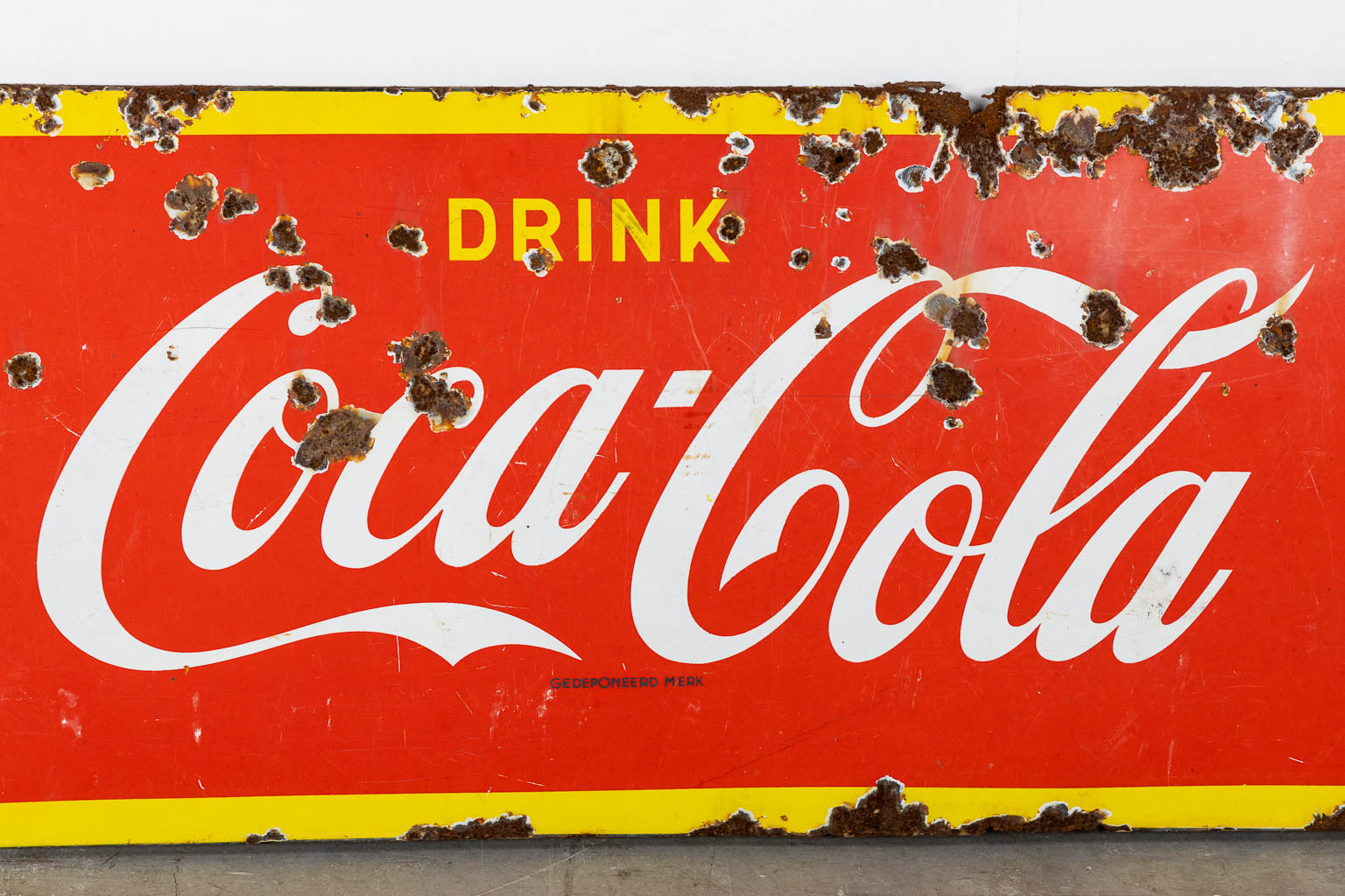 "Drink Coca Cola", a large enamel advertising board, 1957. (W:145 x H:46 cm)