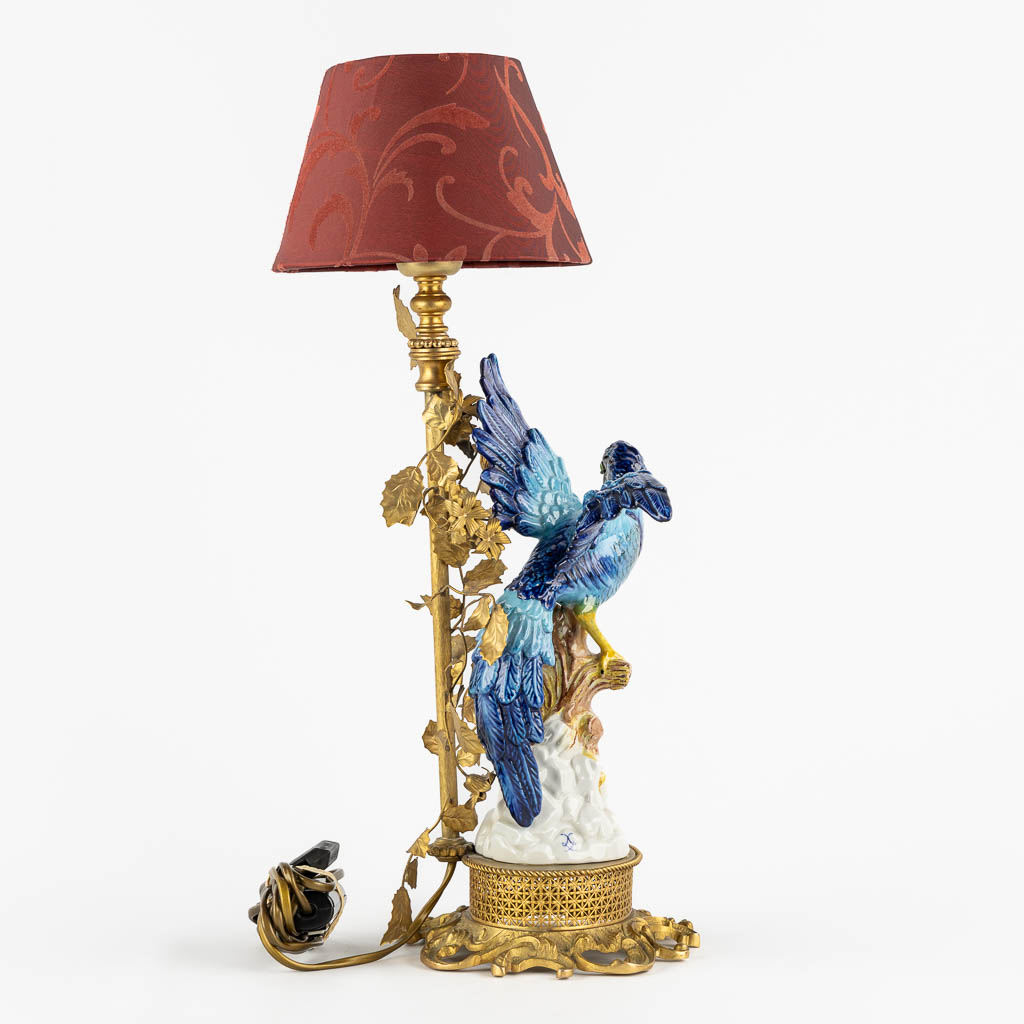 A decorative table lamp, brass mounted with polychrome porcelain. (L:16 x W:18 x H:45 cm)