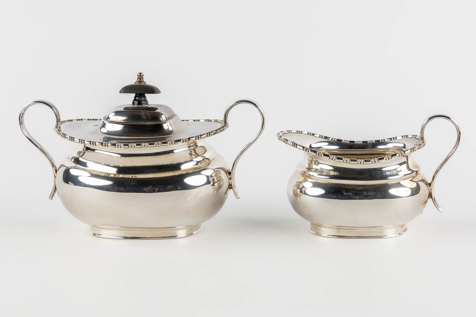 A 5-piece coffee and tea service, Silver-Plated, Sheffield UK. (L:38 x W:59 cm)