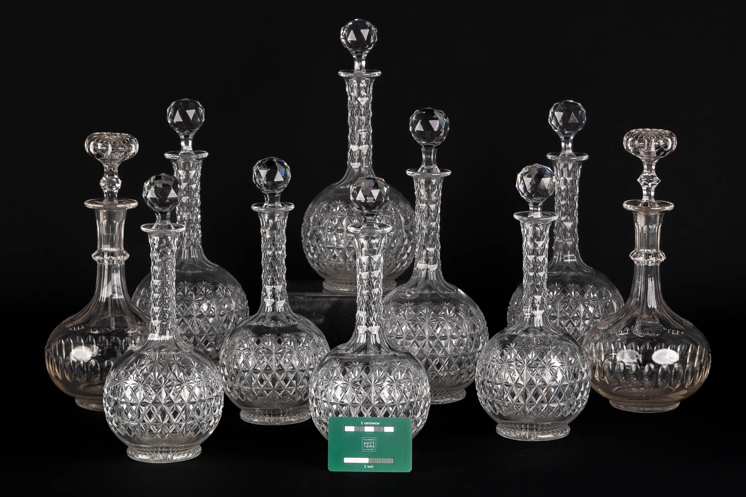 A matching set of 8 caraffes, added are a pair. Cut crystal. (H:34 cm)