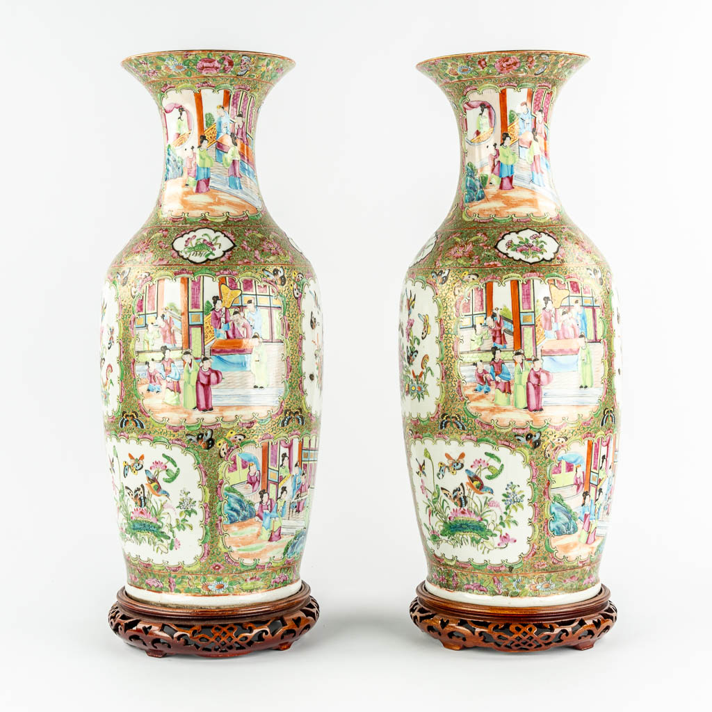 A pair of Chinese Canton vases, decorated with Ladies, fauna & flora, 19th C.