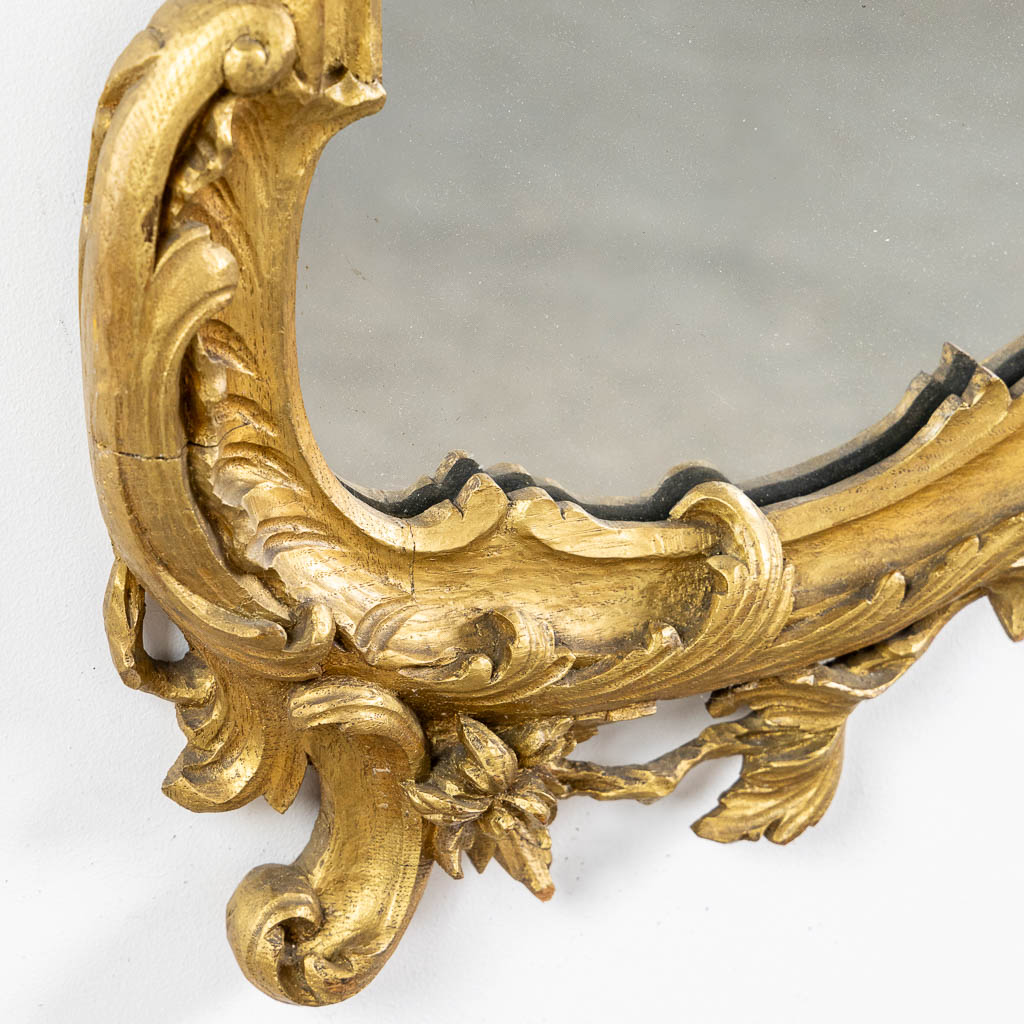 An antique wood-sculptured mirror, Louis XV style. Circa 1900. (W:93 x H:135 cm)