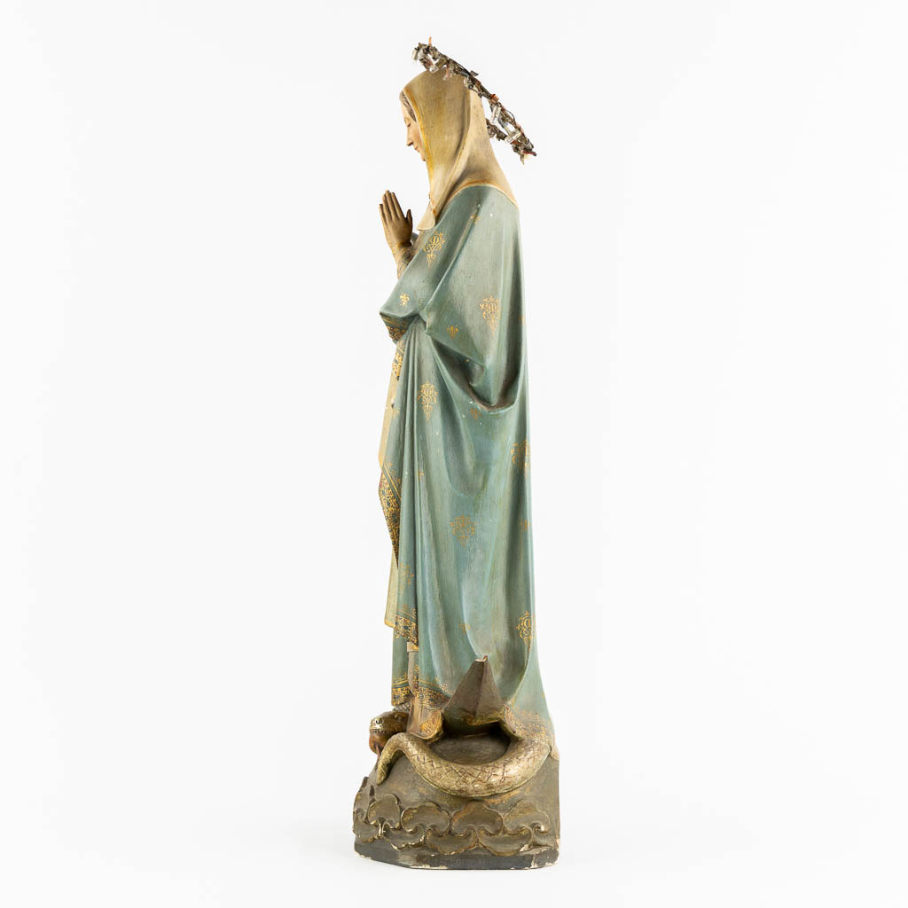 A Gothic Revival Virgin Mary on Crescent moon trampling the serpent, Polychrome plaster. Circa 1900. (H:81 cm)