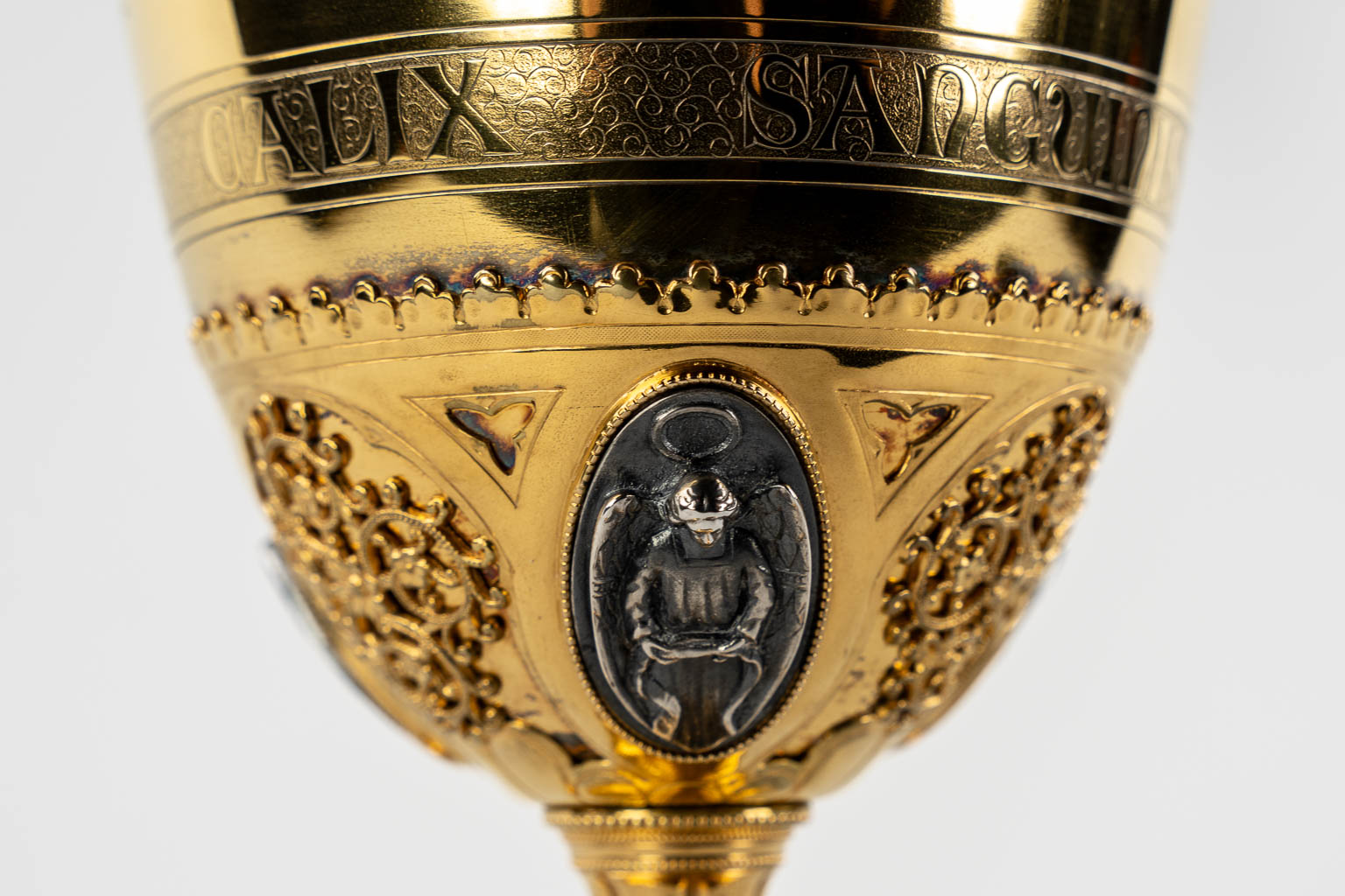 A Gothic Revival chalice with enamel plaques, cabochons. Silver Cuppa, Gilt brass, 19th C.